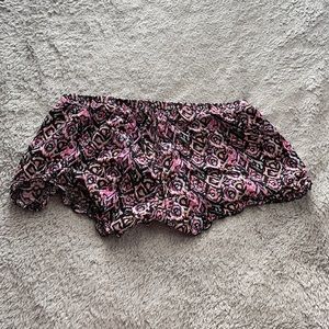 pink, peach, and black decorative shorts